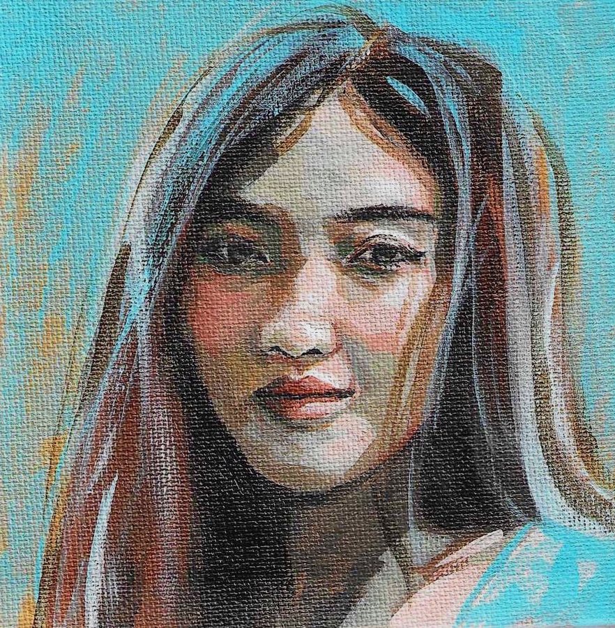 Portrait of a woman on a turquoise background