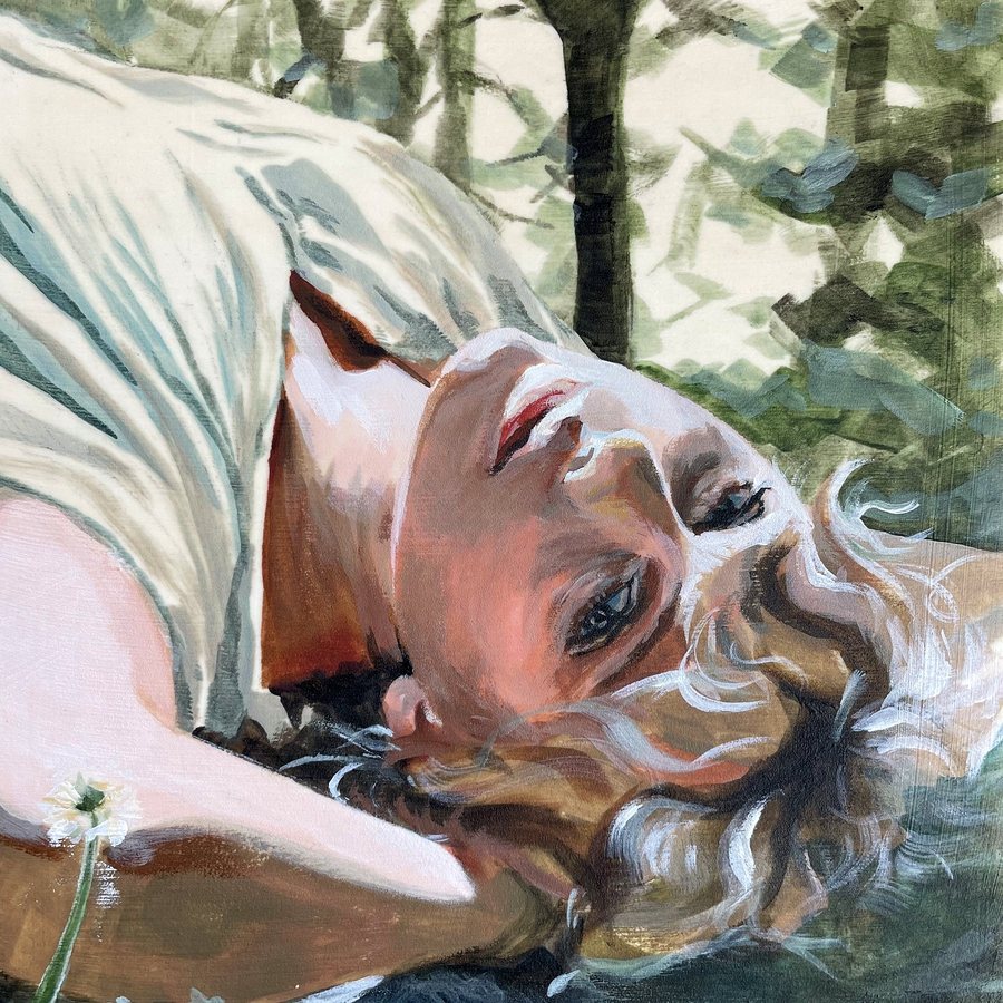 A woman lying in a forest