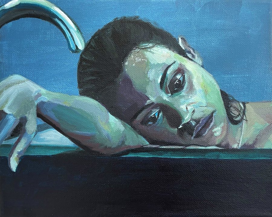 Woman resting her head on her arm, in blues