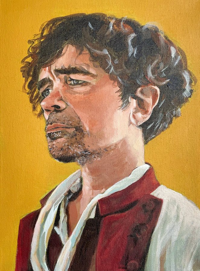 A man with curly hair on a golden background