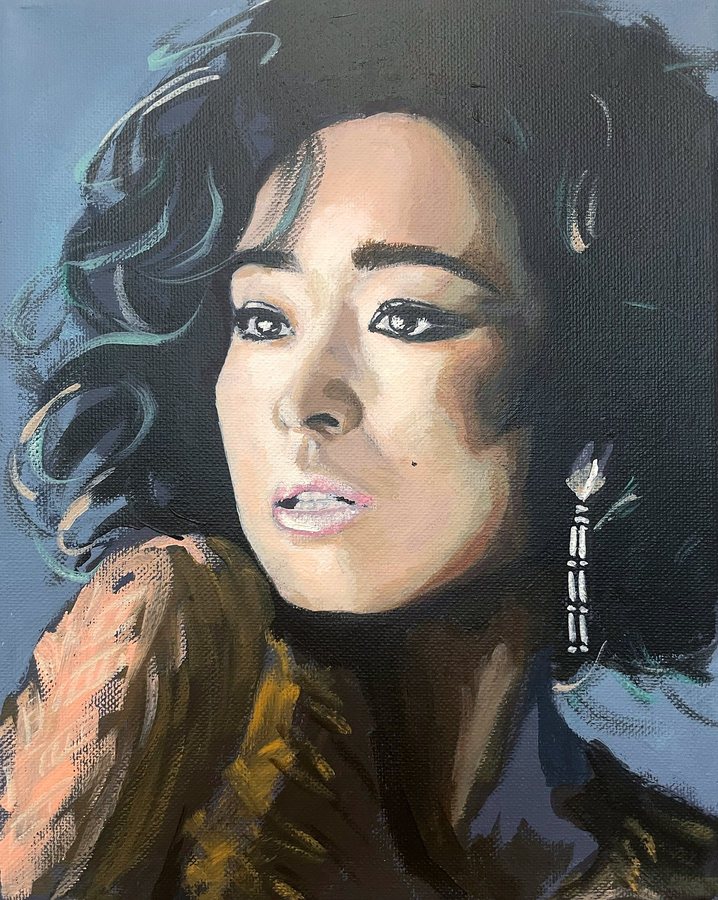 Portrait of a woman with dark curly hair
