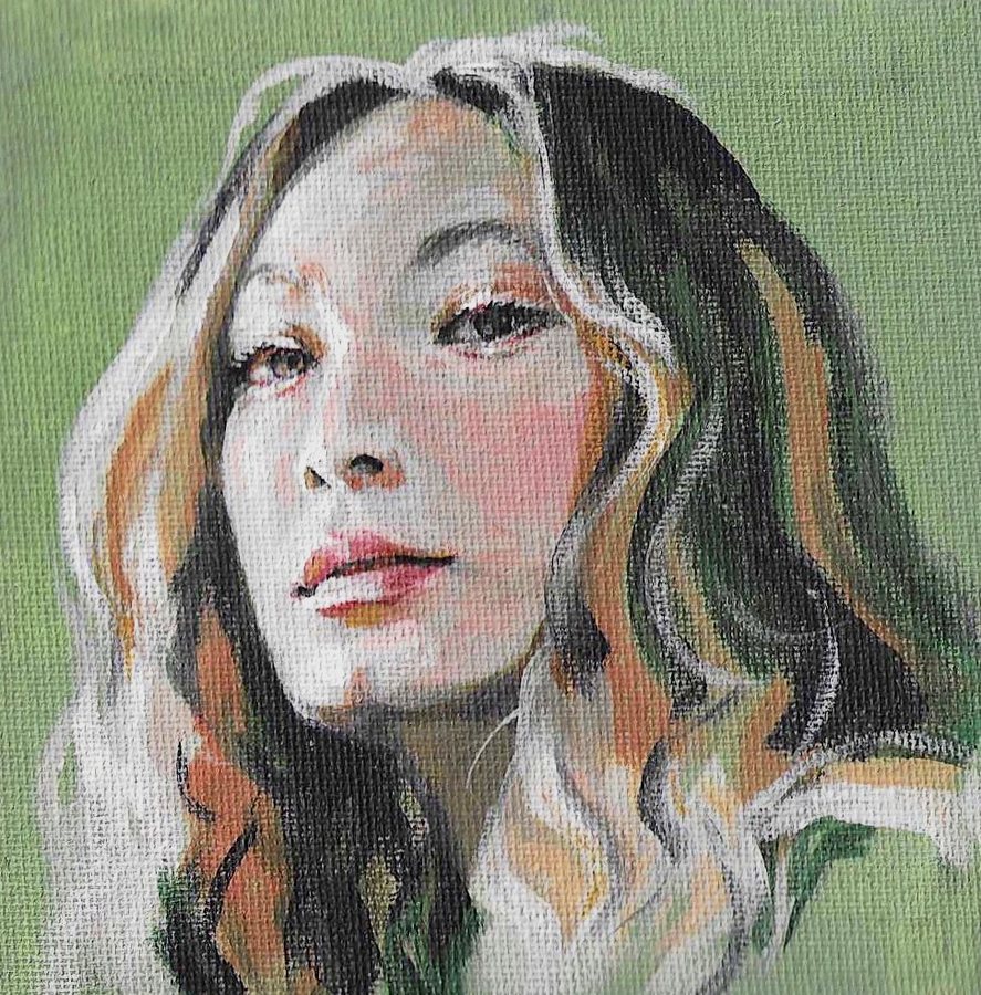 Portrait of a woman on a sage green background