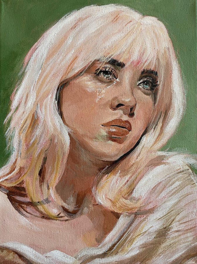 A woman with pale blonde hair on green
