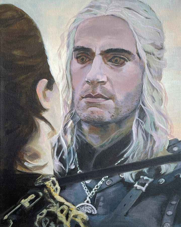 A white-haired man with a woman in the foreground