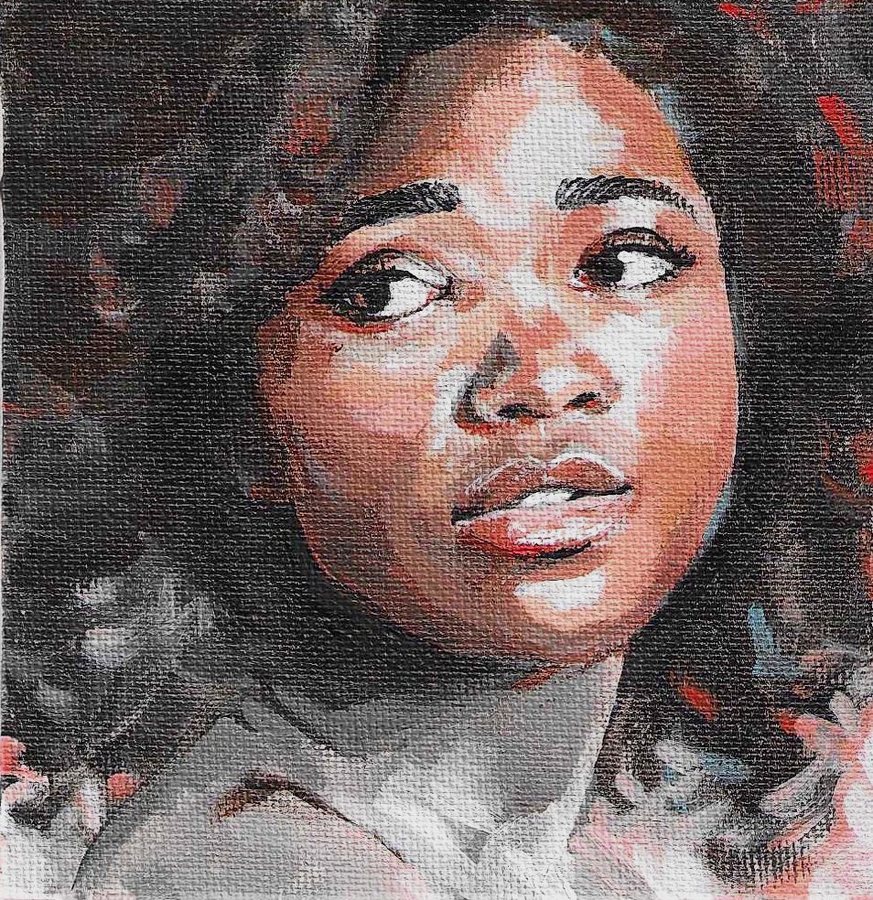 Portrait of a woman with curly hair looking up