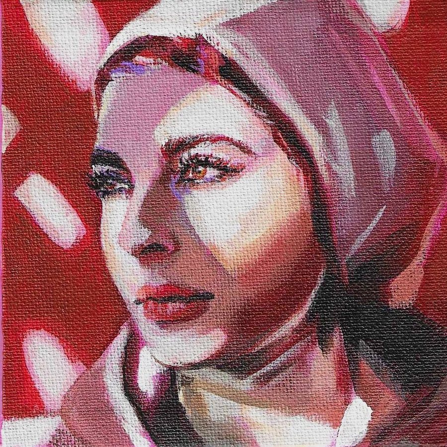 Portrait of a woman in a pink hood