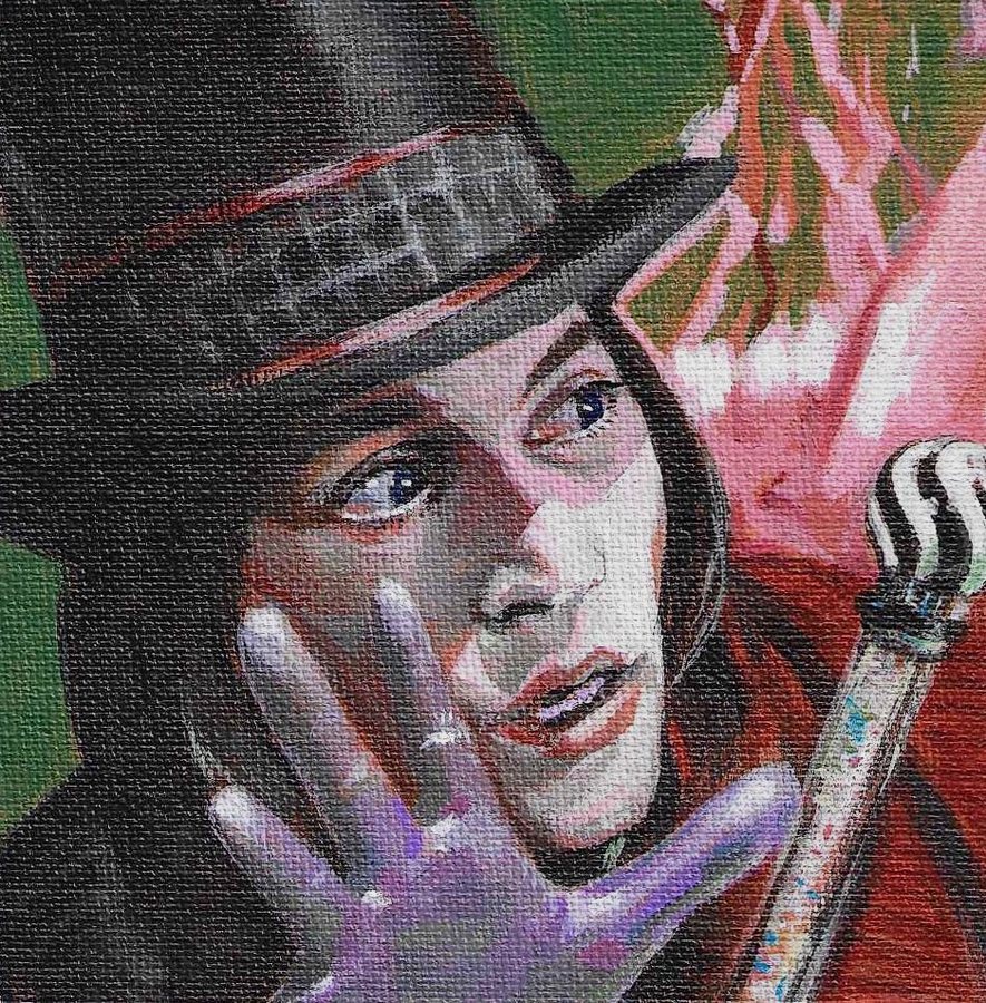 A man in a top hat holding up his gloved hand